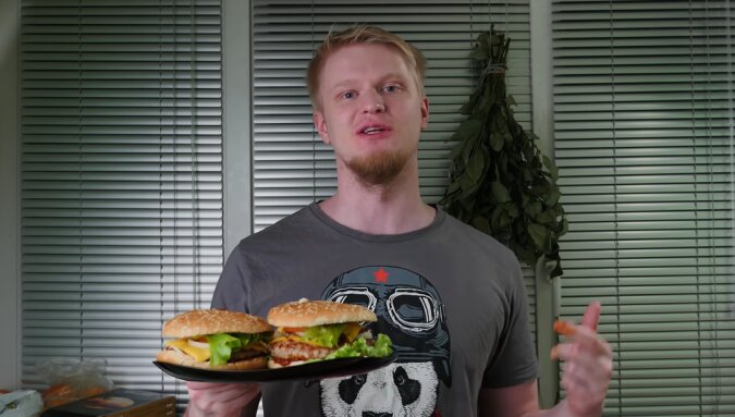 Mann und Burger. Quelle: Screenshot YouTube